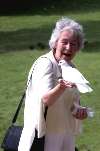 Mum feeds the doves at Prinknash Abbey