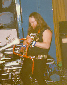 Dumpy, shown here without his Rusty Nuts, on (for reasons which escape me) handlebar at a Rock Soc gig.